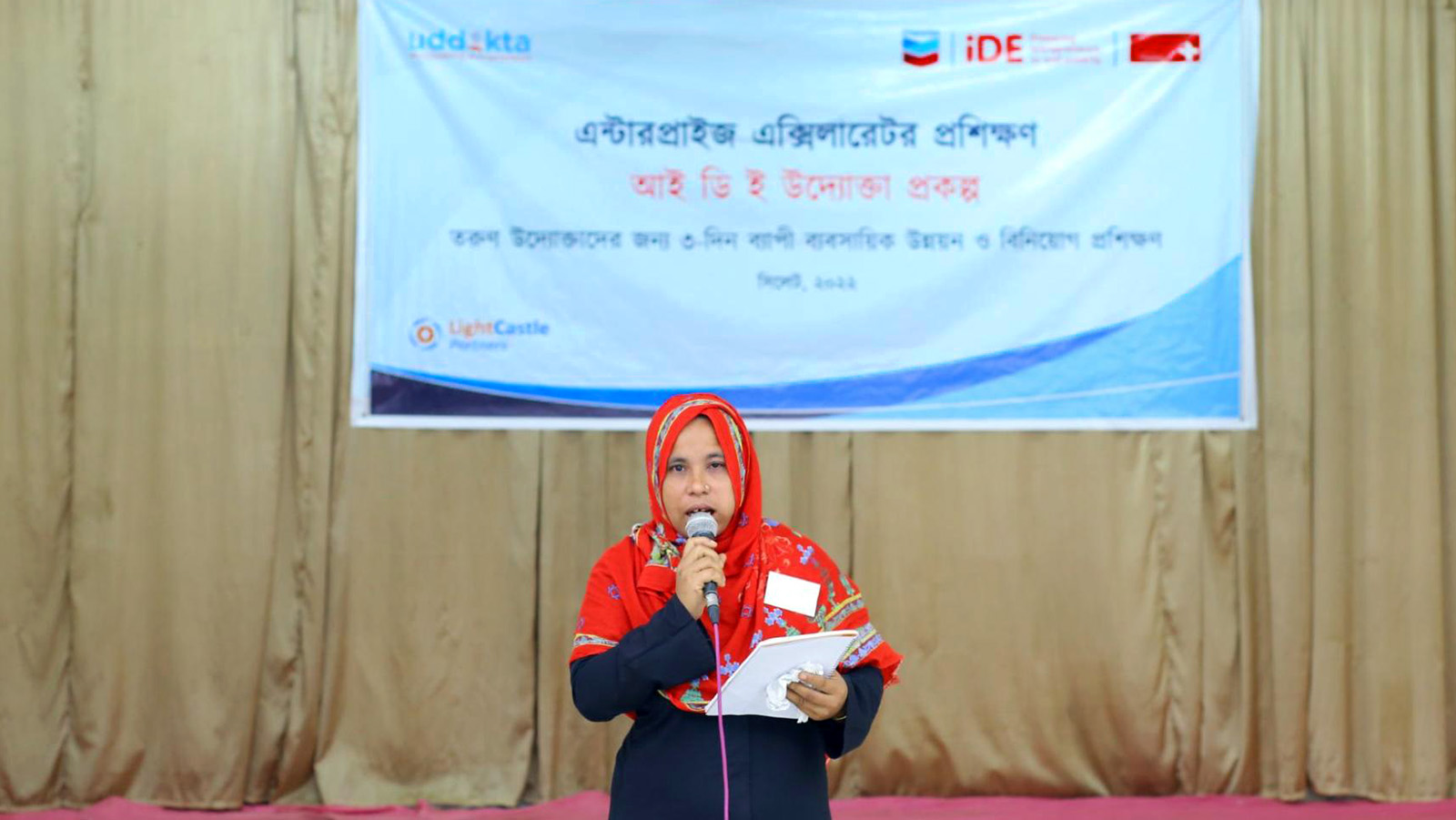A female SME owner practicing her pitch at the training program in Sylhet