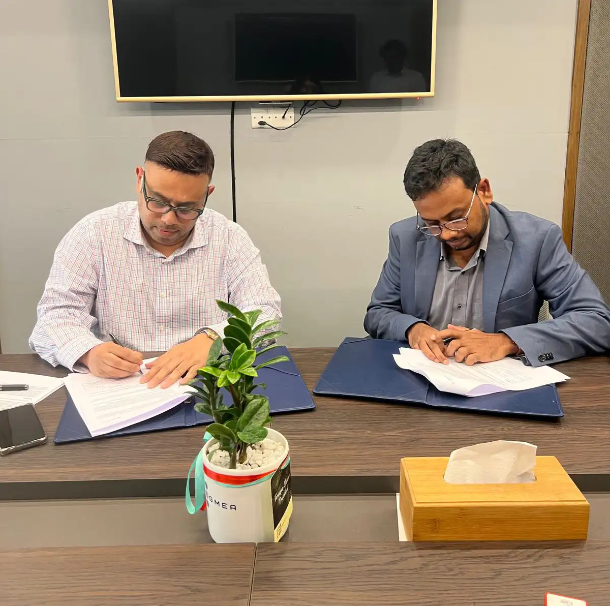 Zahedul Amin and Dr Masrur Reaz, Chairman, Policy Exchange, signing the MoU